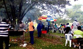 Guests at an outdoor braai and party